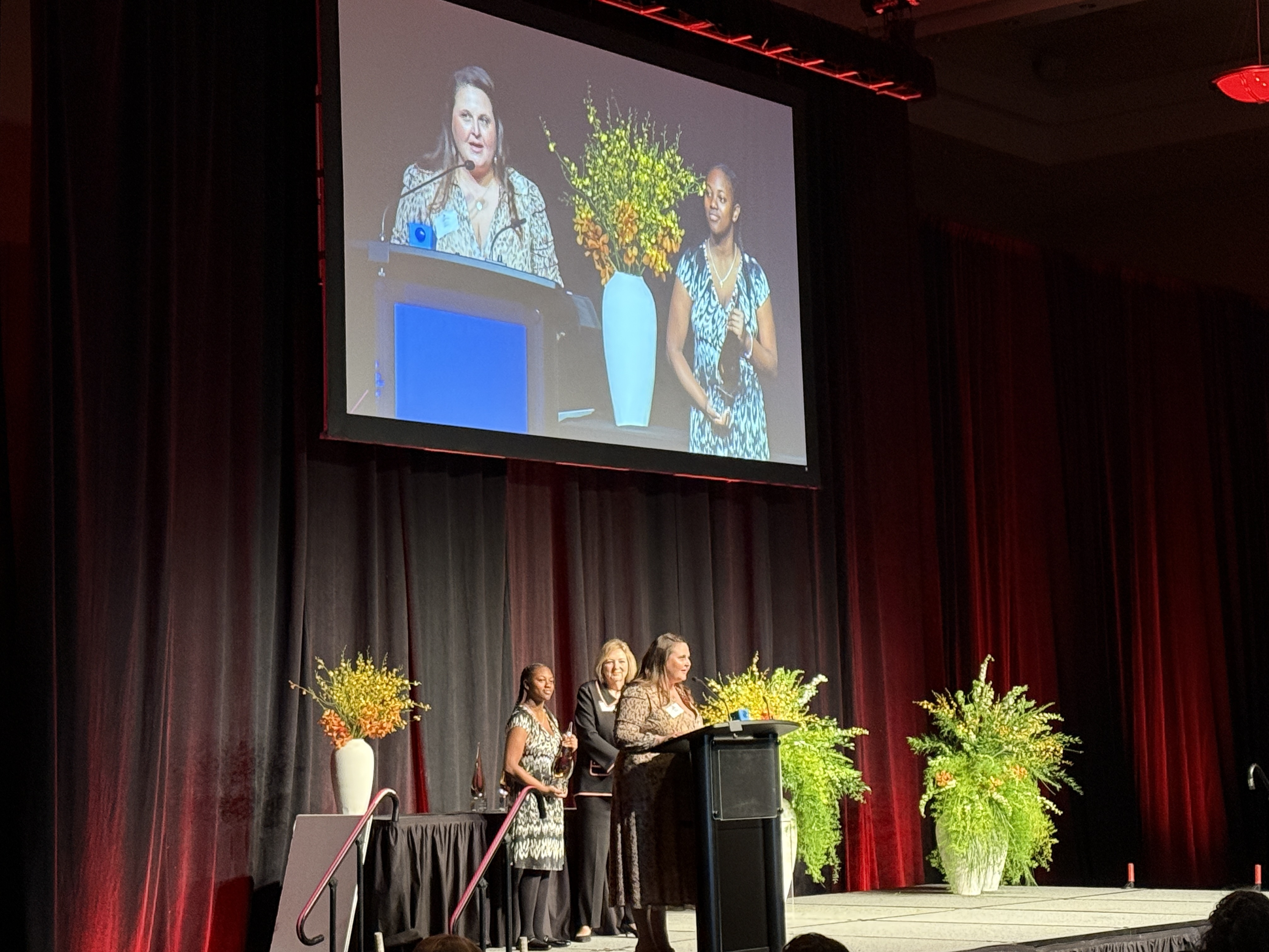 Lauren Micek Vargas on stage at the award ceremony.